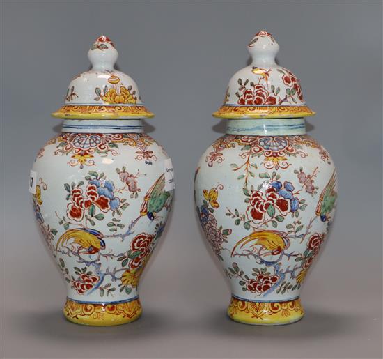 A pair of 19th century French faience vases and covers height 29cm